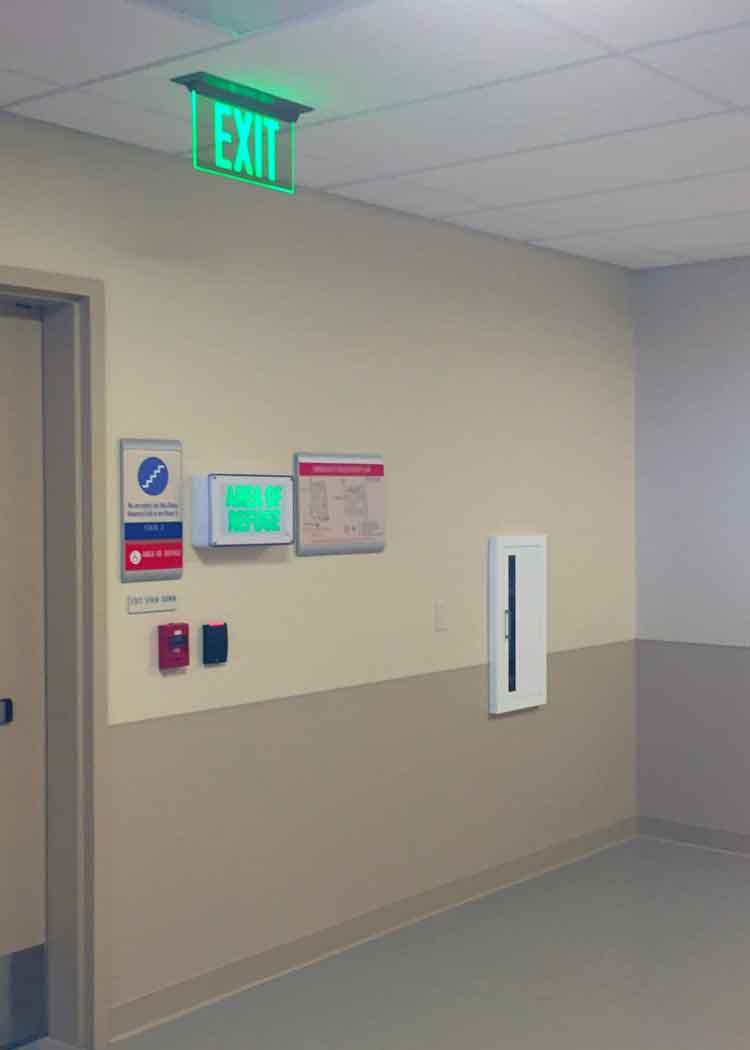 The ELT Elite Edge-Lit Exit Sign is seen here in a retail store environment.
