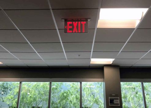 Example of the The Isolite Elite Edge-Lit Exit Sign's illumination in an office environment. The Isolite ELT.